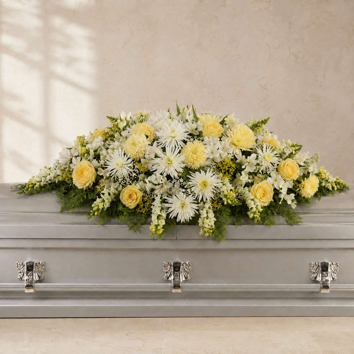 Butter yellow and cream white casket spray