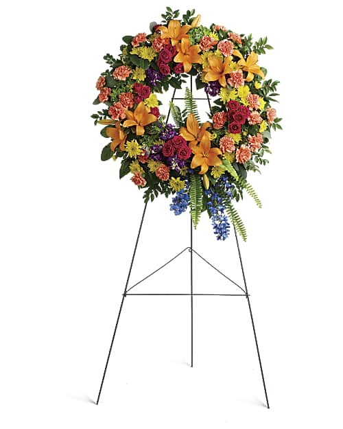 Colorful mixed flower remembrance wreath on a standing easel