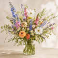 Colorful wildflower arrangement in a clear glass vase